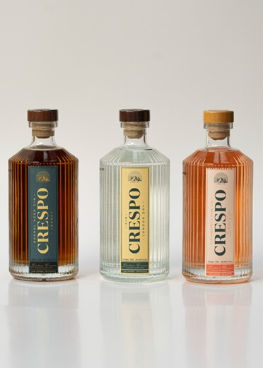 CRESPO Legacy, London Dry, and Luna Rosa gin bottles